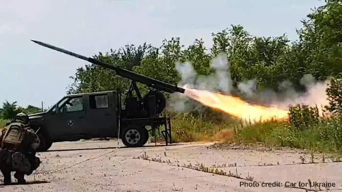 Donate Your UK Car to Ukraine. The photo shows a donated truck converted for use on the front lines.